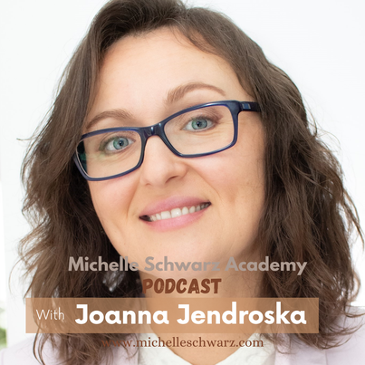 Joanna, health coach headshot, brunette woman with glasses, smiling