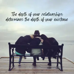 seeing the backs of three friends sitting on a bench